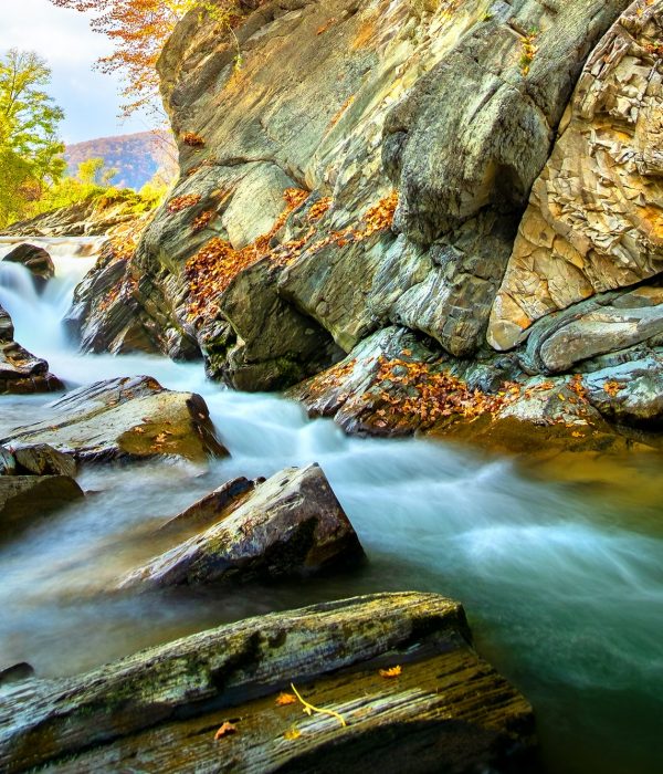 Mountain river with small waterfall with clear turquoise water